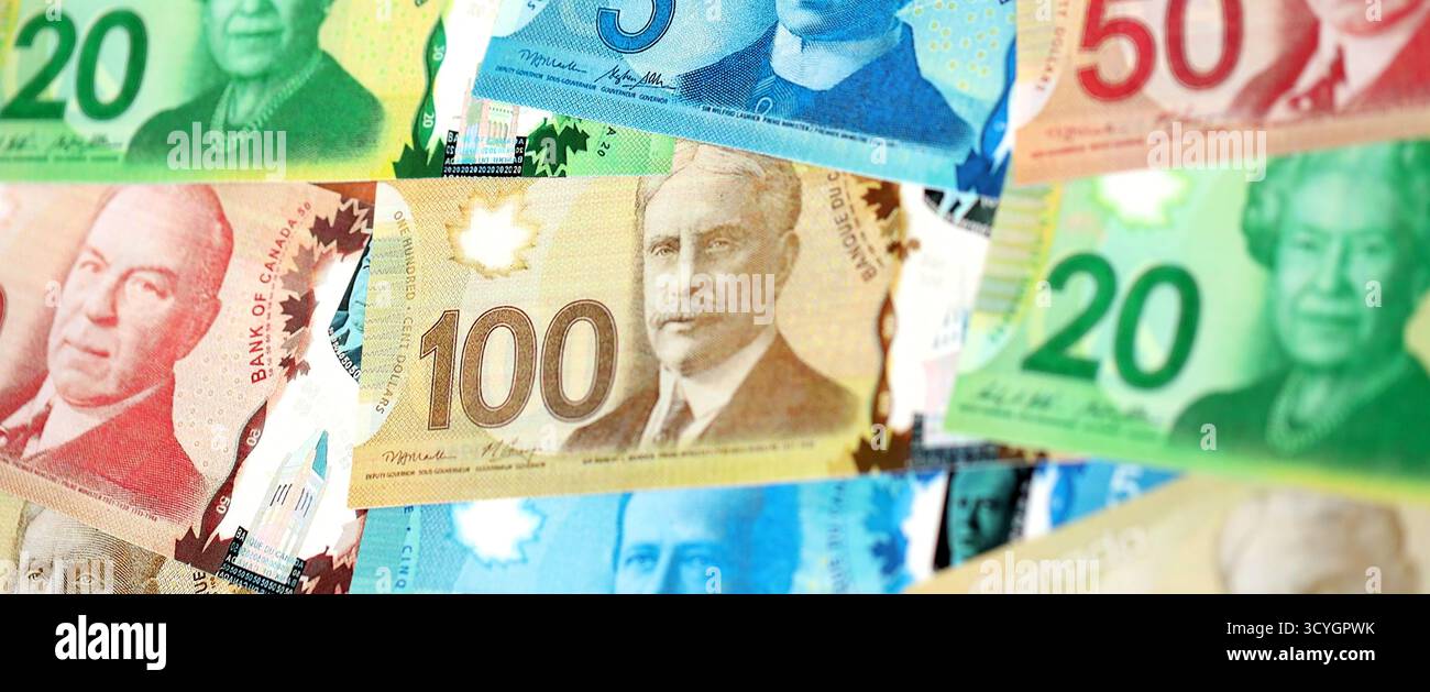 Canadian Dollar currency money bills. CAD currency banknotes in big bunch  with different denomination close up Stock Photo - Alamy