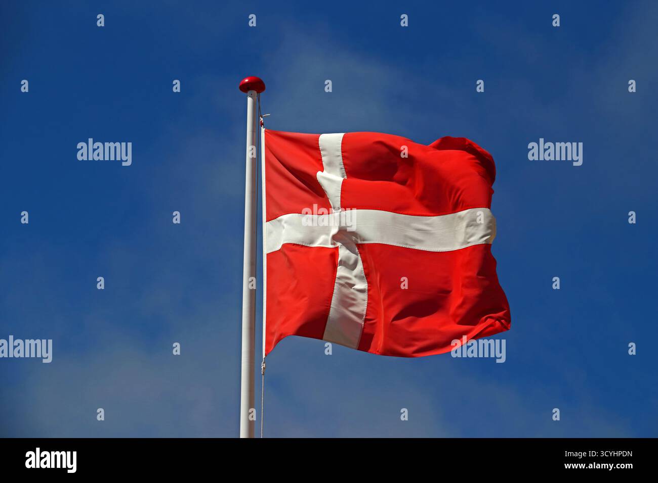 Danish national flag flying at flagpole, Skagen Stock Photo - Alamy