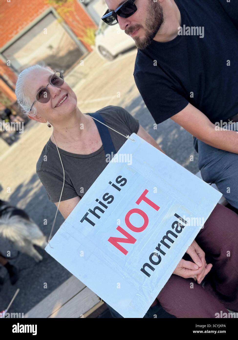 A woman shares her views on a sign in the Abbot Kinney protest Stock ...
