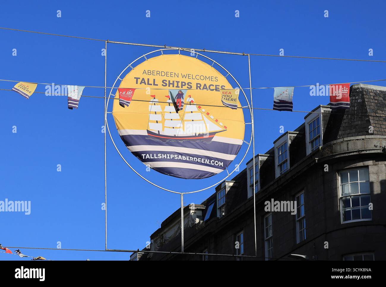 Banners for Aberdeen's Tall Ships Races in July 2025 on Union Street, it was nearly 30 years since the city hosted the event, 45 vessels took part. Stock Photo