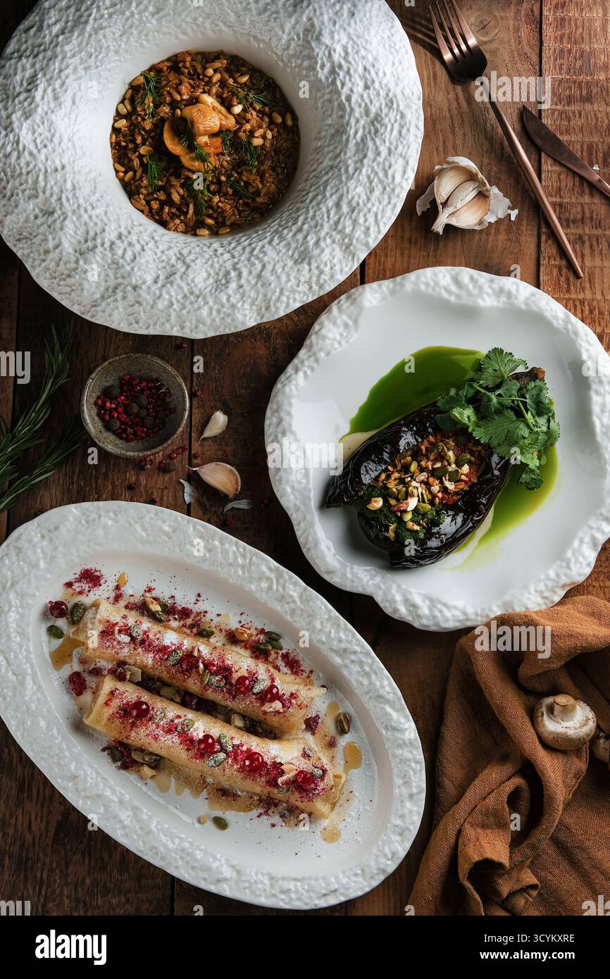 elegant gourmet plating, refined minimalist dinner with floral garnishes and grilled vegetables Stock Photo
