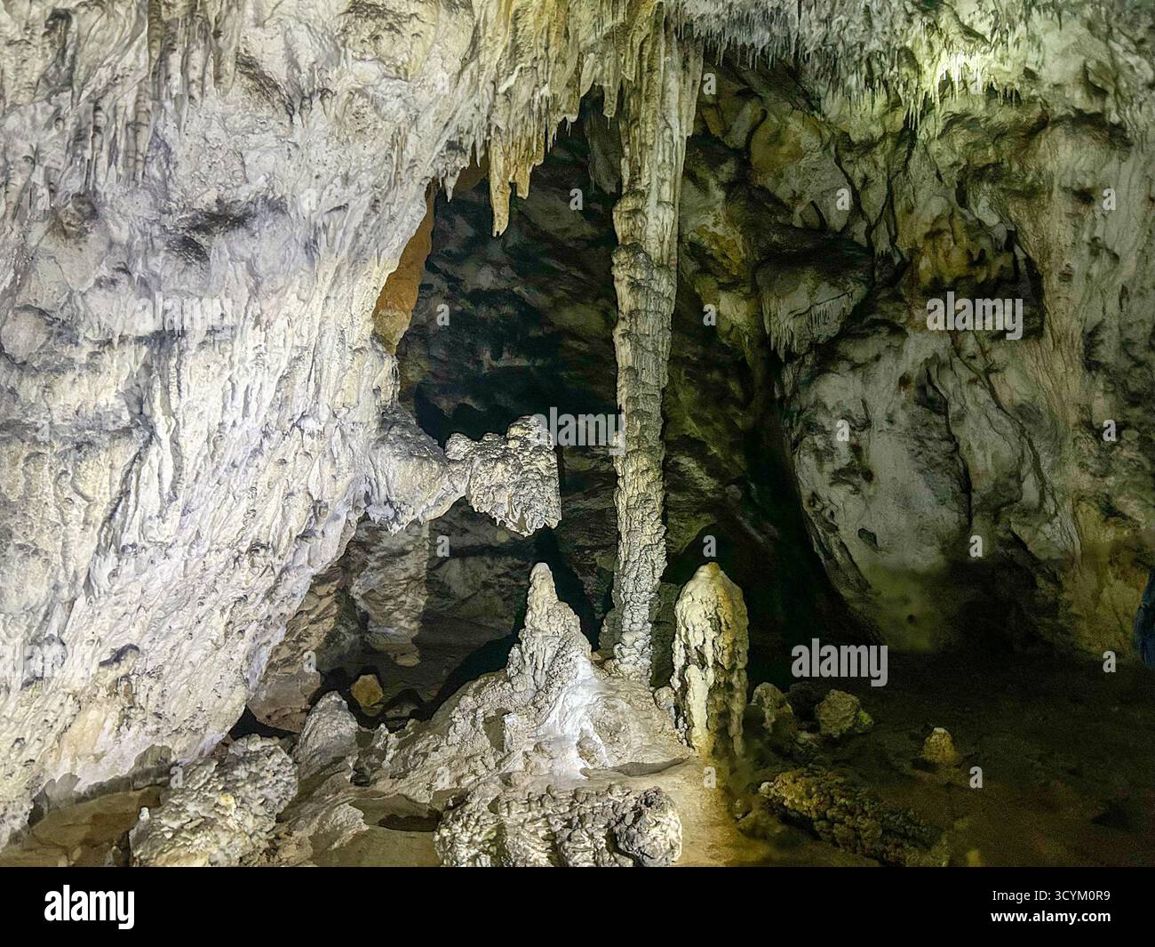 Stunning stalactites and stalagmites inside the Ice Cave in Uvac Canyon, showcasing the natural beauty and geological formations of this underground w - Smartphone Captured Stock Image