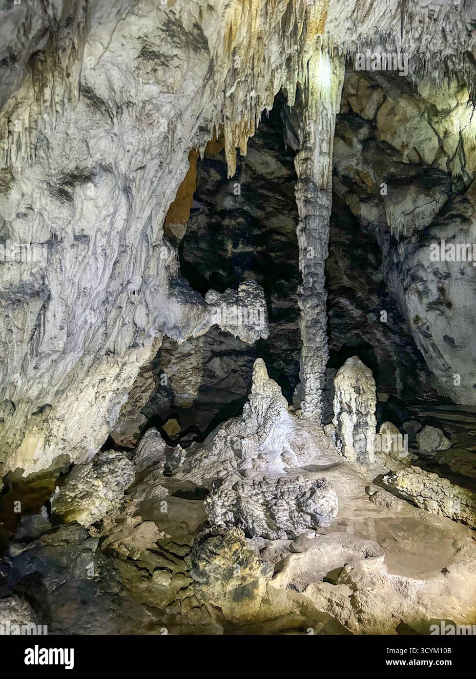 Impressive limestone formations, stalactites, and stalagmites inside the Ice Cave in Uvac Canyon, a fascinating underground natural attraction in Ser - Smartphone Captured Stock Image
