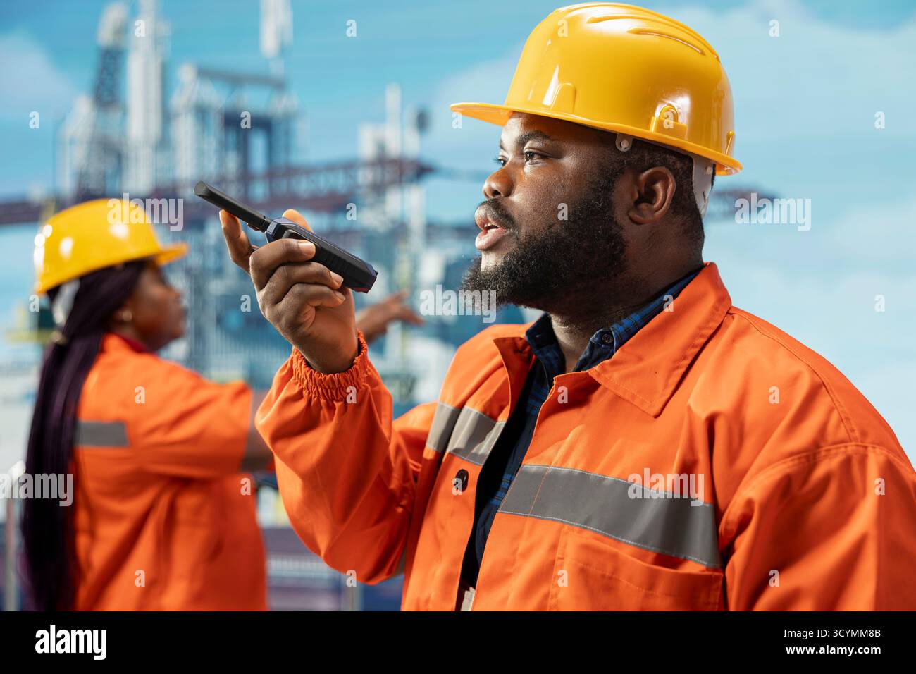 Employee Using Radio African american engineer speaks walkie hi-res stock photography and ...