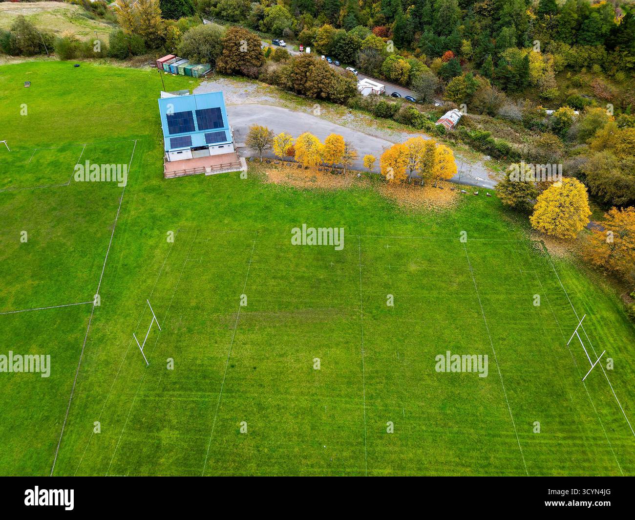 Aerial drone view of a local rugby pitch and clubhouse surrounded by ...