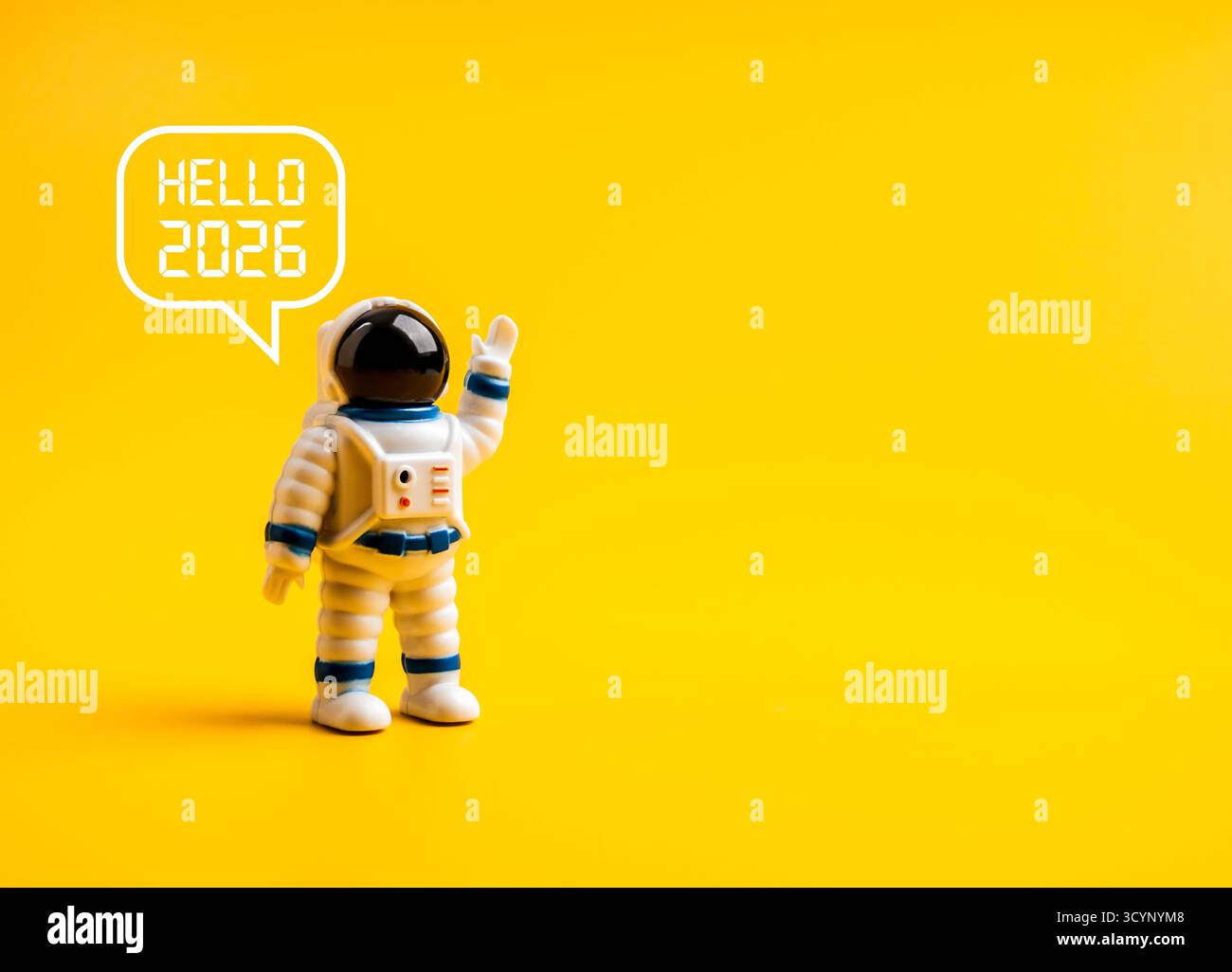 Cute astronaut figure waving with speech bubble “Hello 2026” on yellow ...