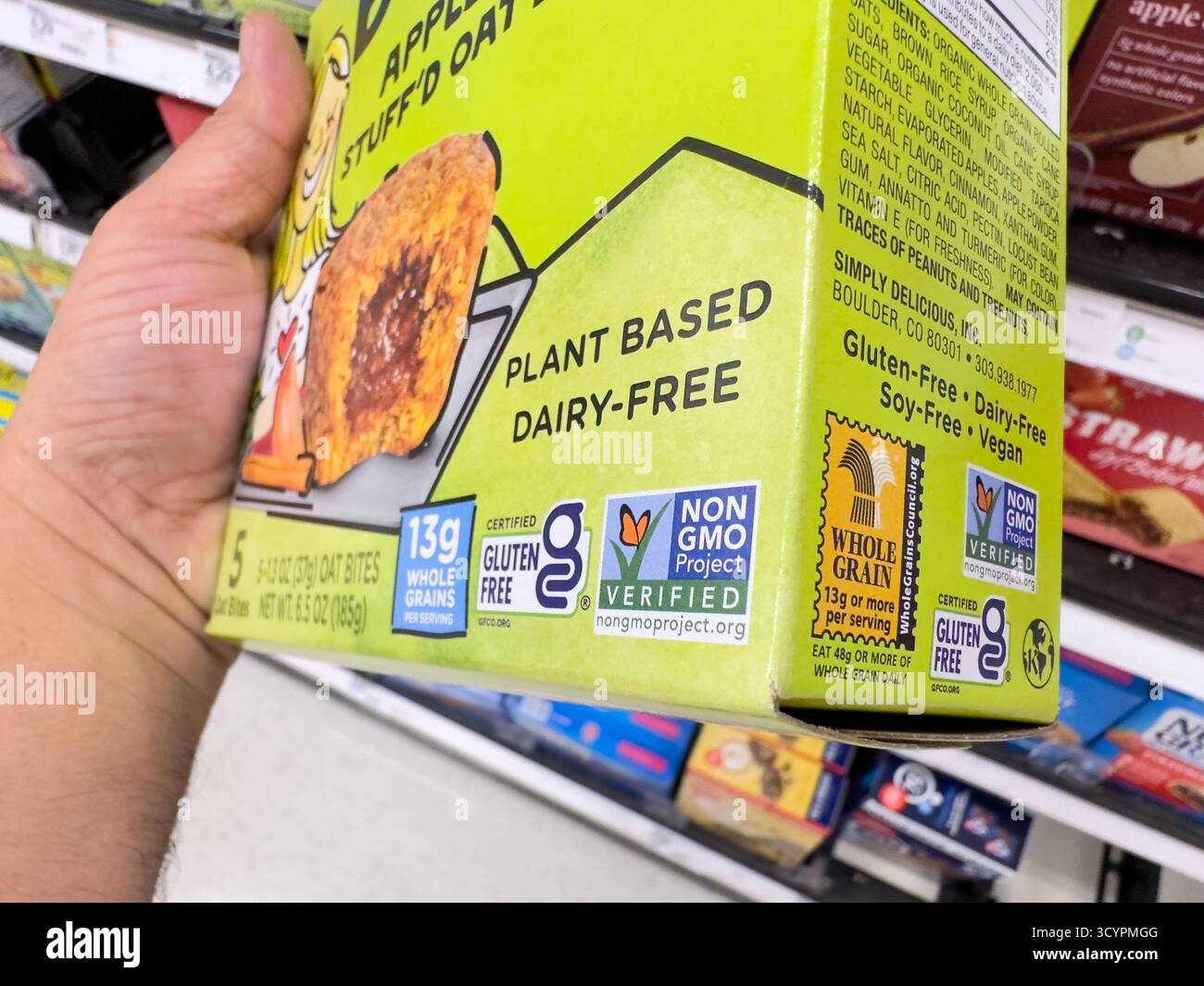 Los Angeles, California, United States - 02-01-2023: A closeup view of the Non GMO Project Verified logo on the corner of a snack box. Stock Photo