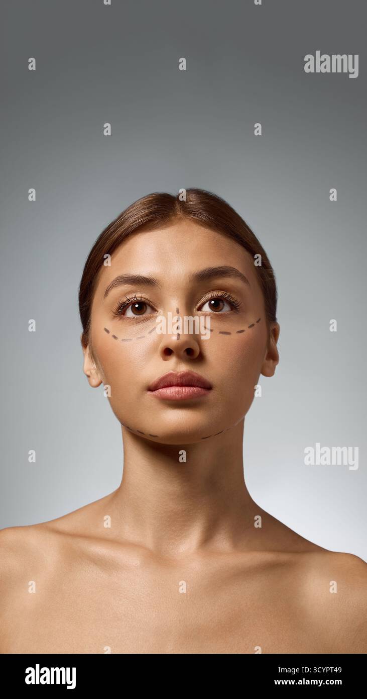 Front portrait of woman with surgery markings showing awareness and ...