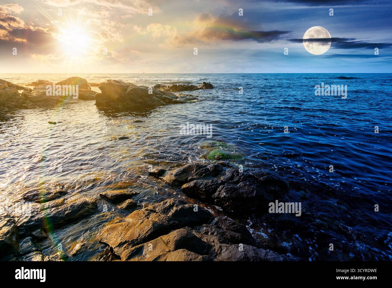 weekend on a rocky beach at the sea. day and night time change concept. beautiful coastline on summer solstice. seascape scenery with clouds above hor Stock Photo