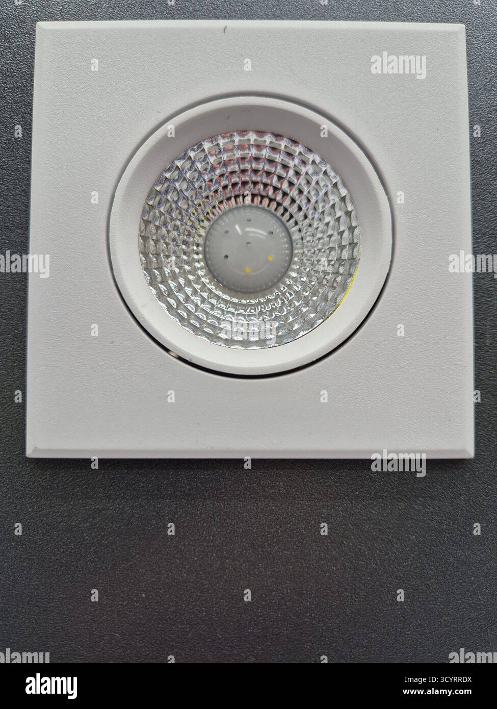 Modern lighting. Recessed LED ceiling lamp with minimalist design - Smartphone Captured Stock Image