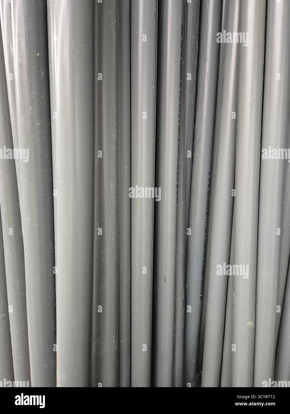 small diameter gray plastic pipes - Smartphone Captured Stock Image