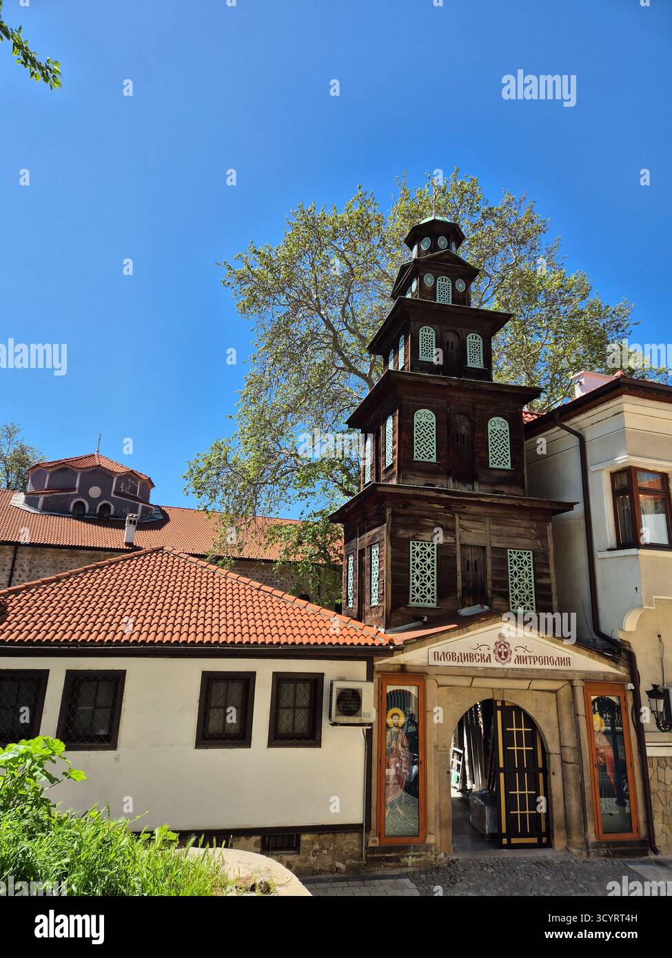 An architectural structure in the city of Plovdiv (probably a church or bell tower), which has a multi-tiered, stepped structure with dark brown woode - Smartphone Captured Stock Image