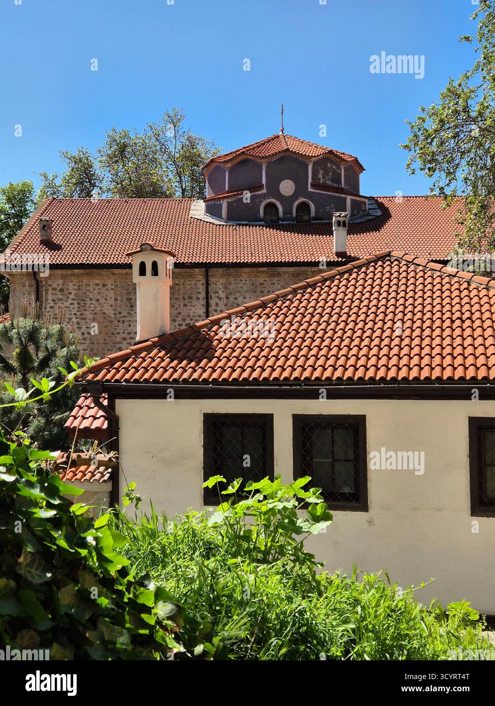 An architectural structure in the city of Plovdiv (probably a church or bell tower), which has a multi-tiered, stepped structure with dark brown woode - Smartphone Captured Stock Image