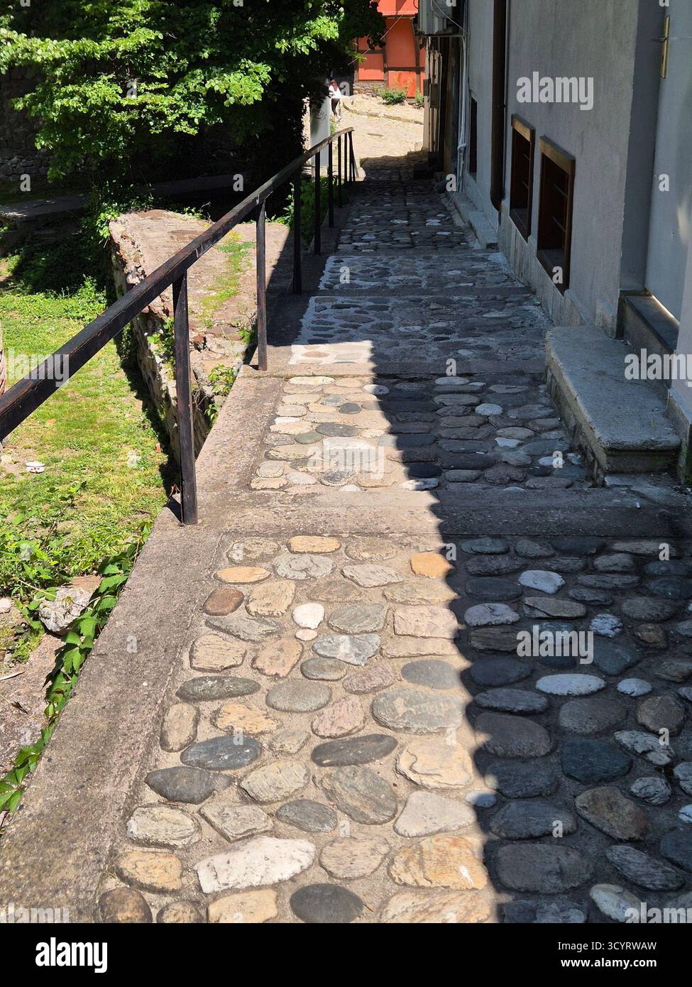 beautiful street view with cobblestone. narrow street/path with cobblestone steps - Smartphone Captured Stock Image
