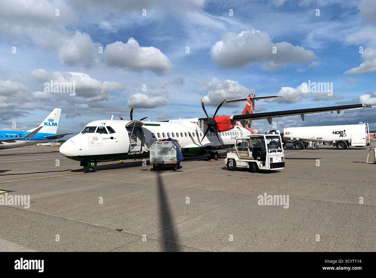 Airport Shetland islands KLM Logan Air British Airways plane planes prop aircraft passengers passenger trip visit   runway clouds view weather truck - Smartphone Captured Stock Image