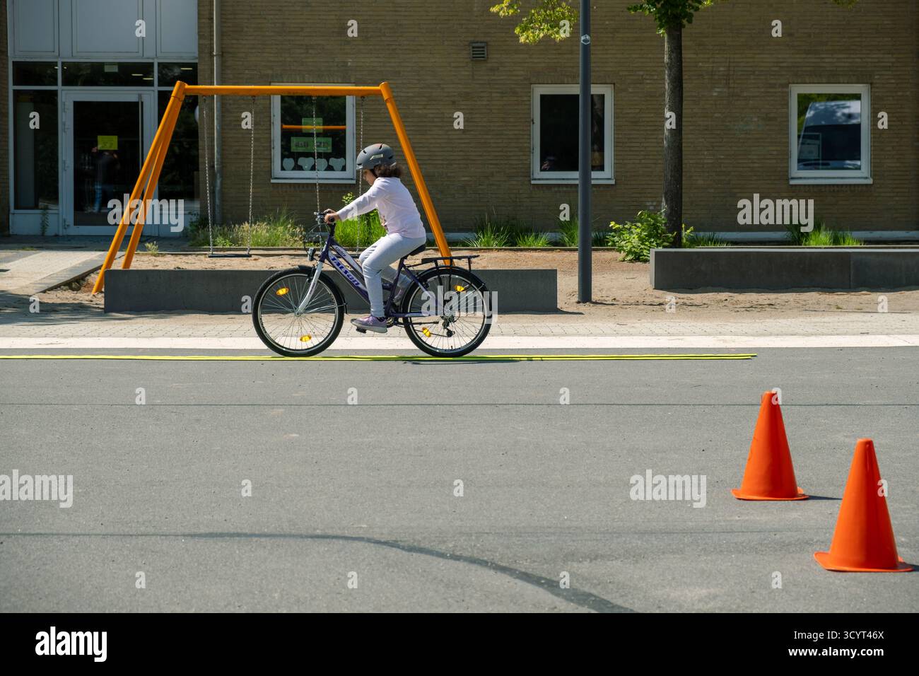 09.07.2025, Germany, Bremen, Bremen - Bicycle training for primary school pupils in a school playground during the summer holidays as a public press e Stock Photo