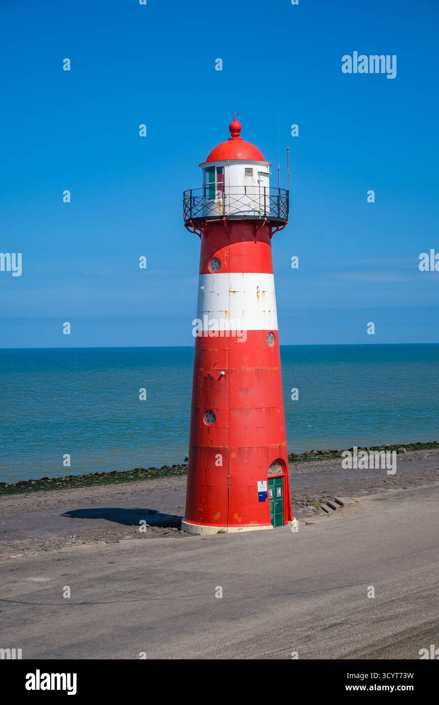 29.06.2025, Netherlands, Zeeland, Westkapelle - Westkapelle lighthouse, 't Lage Licht lighthouse. The lighthouse on the dyke is also called Noorderhoo Stock Photo