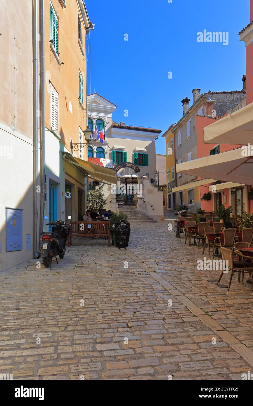 Restaurants on a cobbled street in Rovinj old town, Rovinj, Istria, Croatia, Europe. Stock Photo