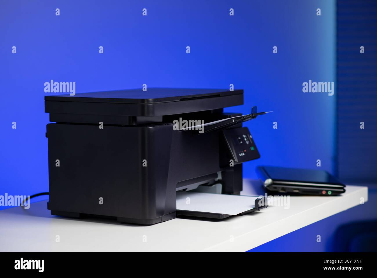 The multi-function laser printer in the home office. Stock Photo
