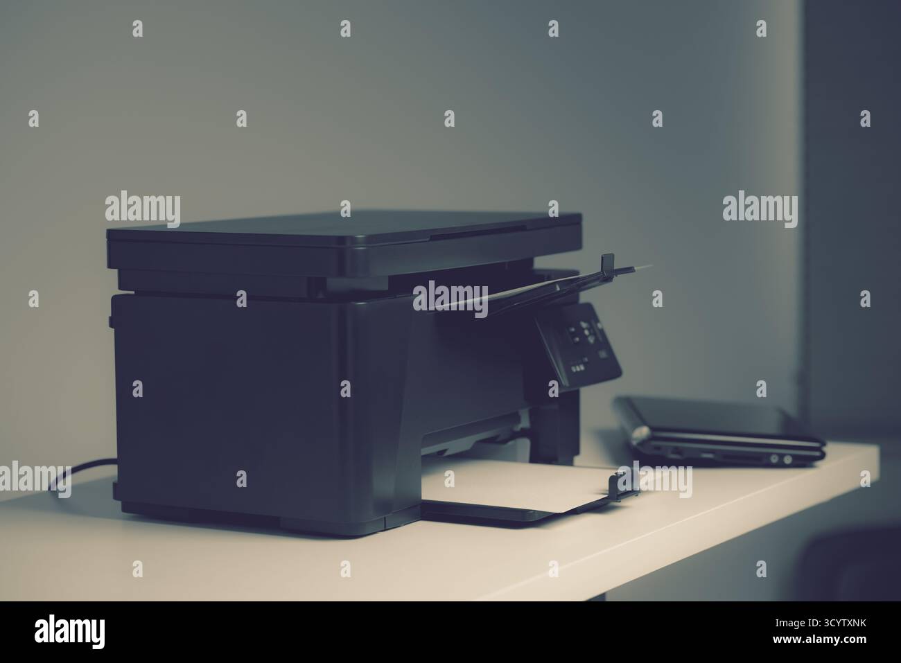 The multi-function laser printer in the home office. Stock Photo