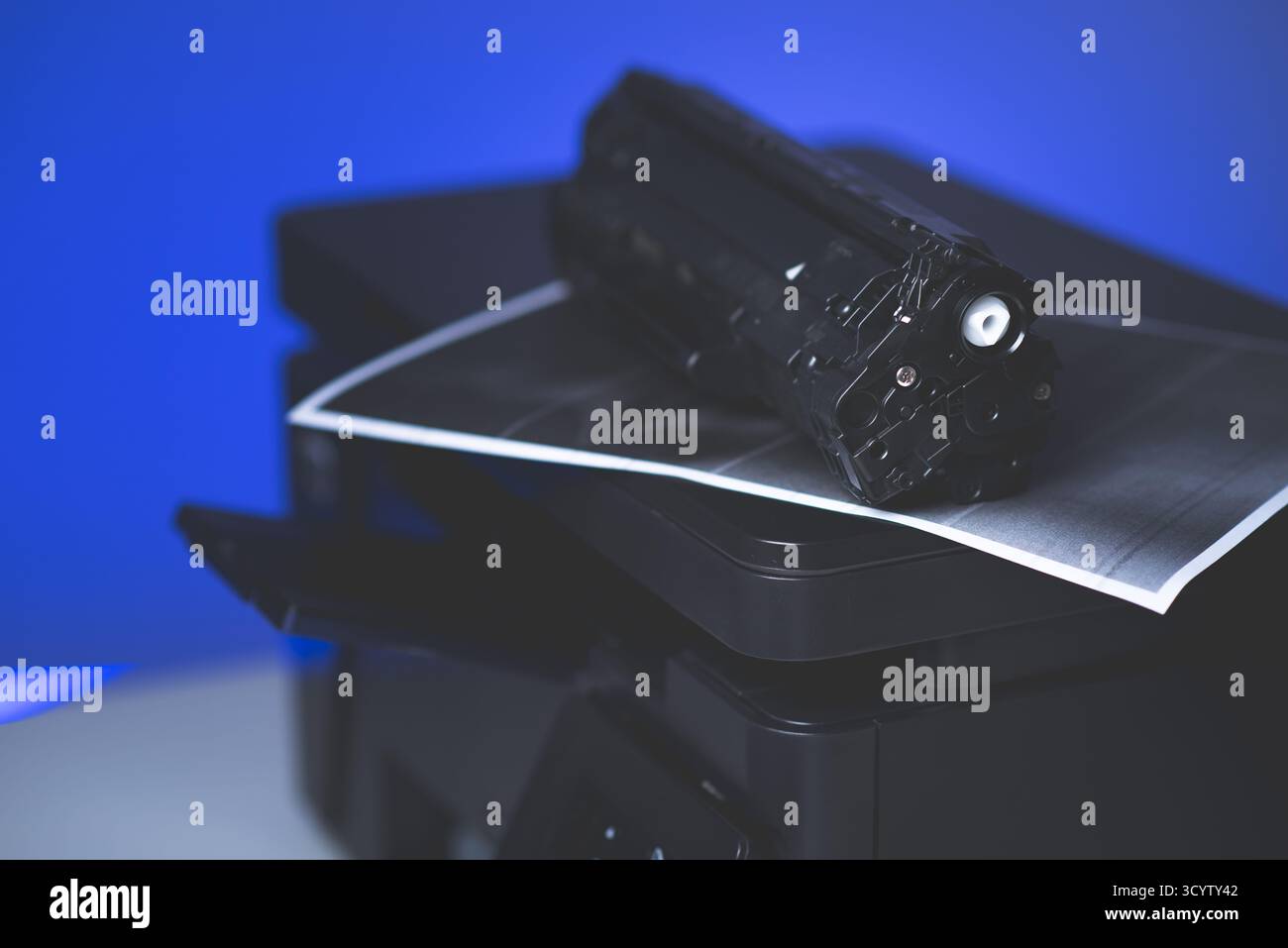 Black cartridge for laser printer. Laser printer issues concept. Stock Photo