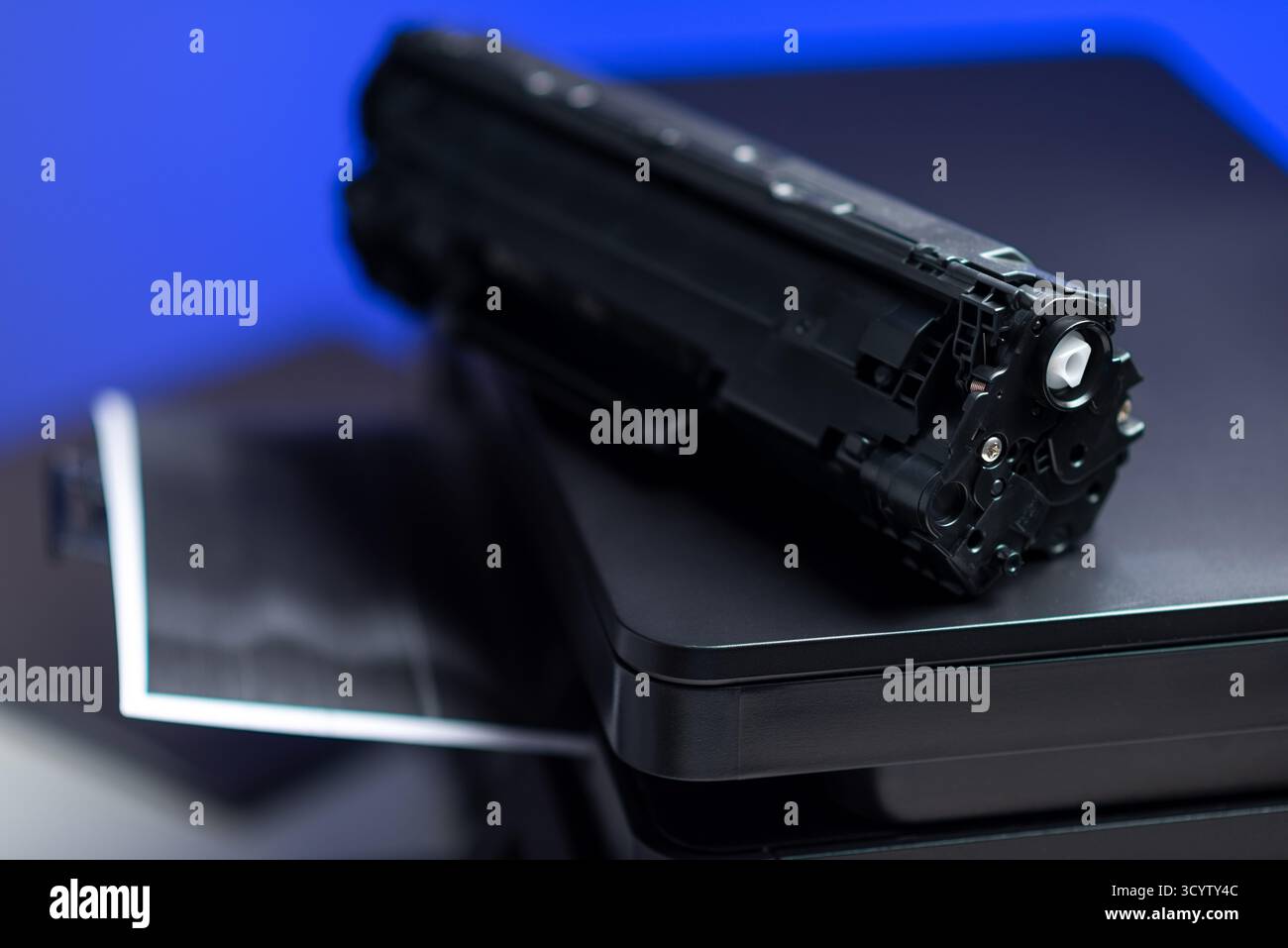 Black cartridge for laser printer. Laser printer issues concept. Stock Photo