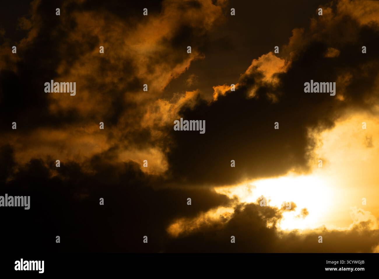 Dramatic Sunset with Dark Clouds Over Newfoundland Landscape Stock Photo