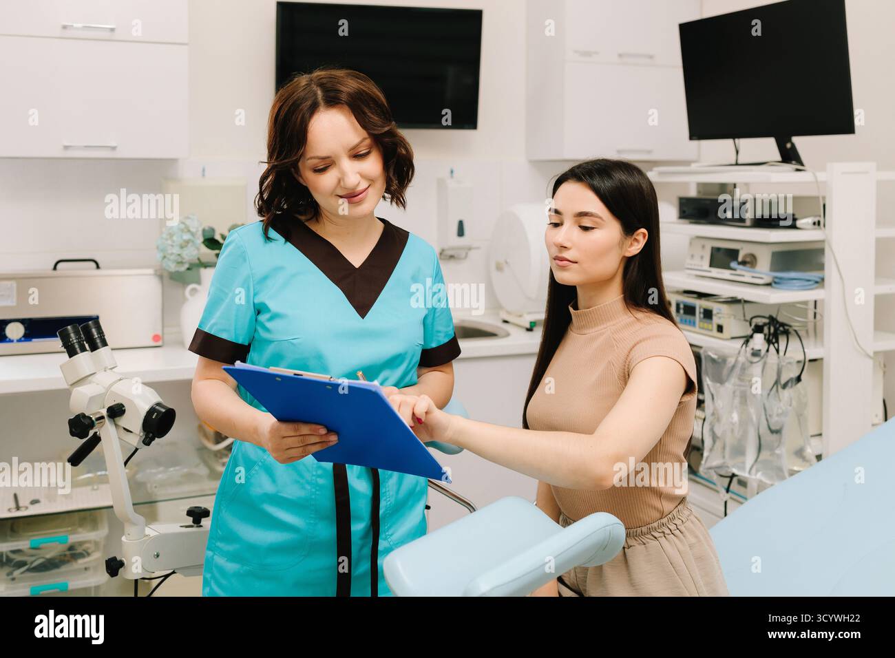 Gynecologist is using colposcopy tools during a gynecological exam ...
