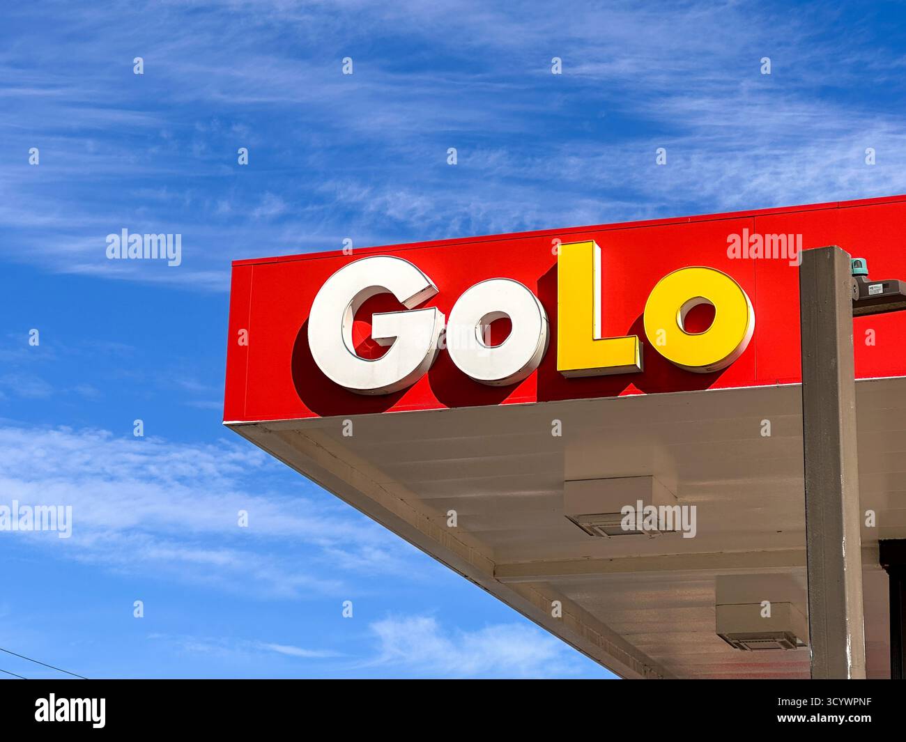 GoLo Gas Station sign and Logo against blue sky - Smartphone Captured Stock Image