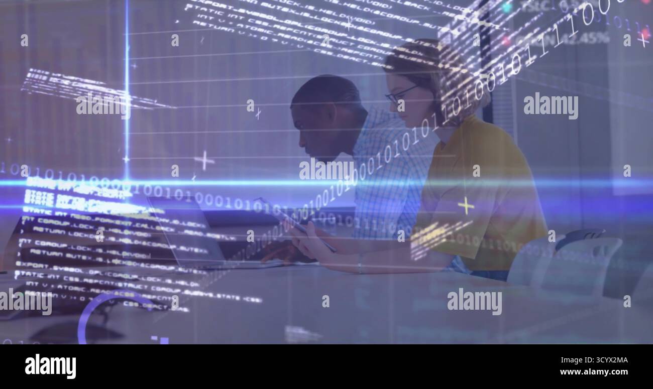 Collaborating software engineers coding at conference table, with laptop tablet pen code overlay Stock Photo