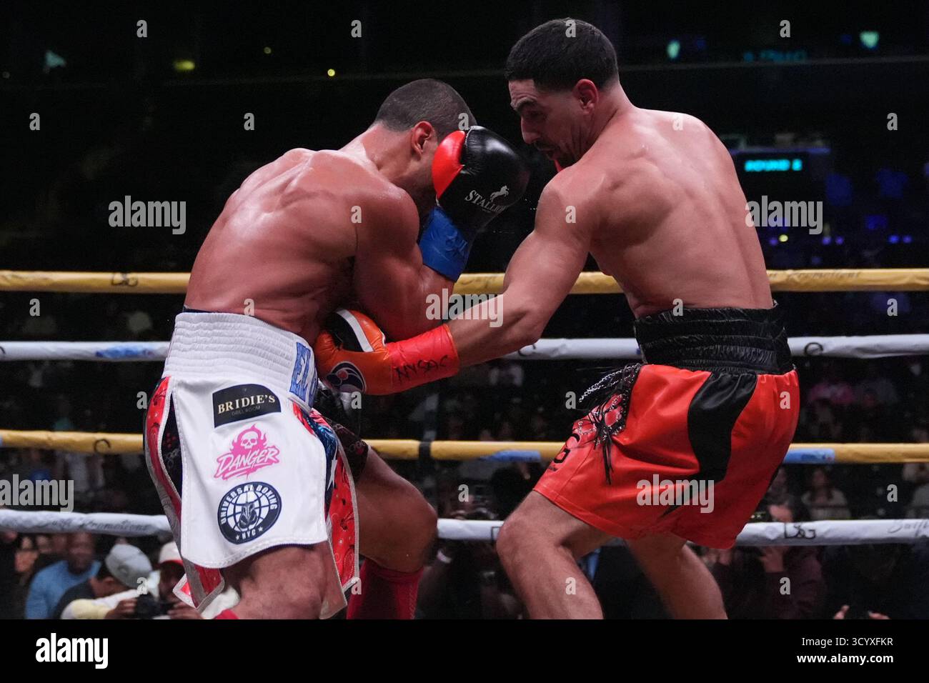 Danny Garcia, right, punches Daniel Gonzalez during the first round of ...