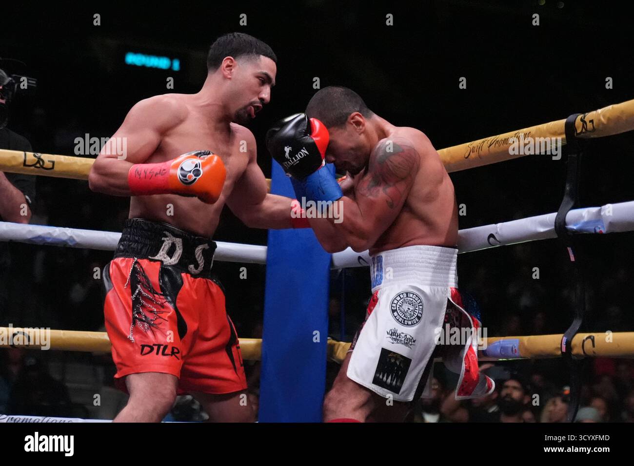 Danny Garcia, left, punches Daniel Gonzalez during the first round of a ...