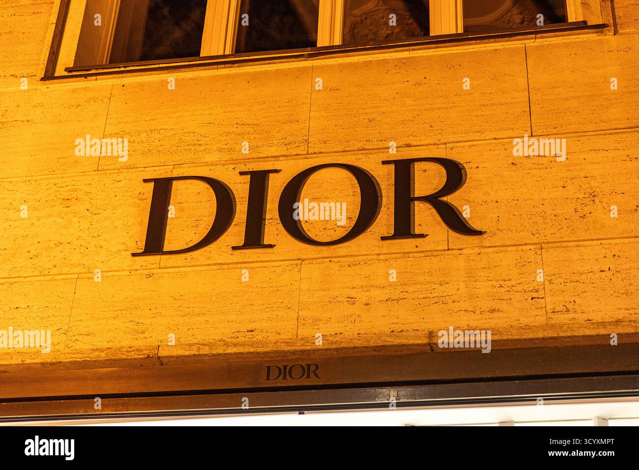 Storefronts along Berlin's Kurfuerstendamm glowed late Monday night ...