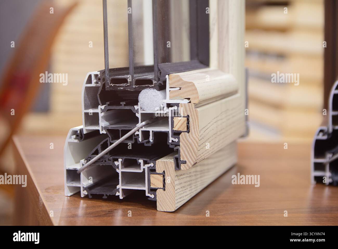 Pvc Wood Frame Window luxury PVC windows with wood trim cross section in the showroom ...