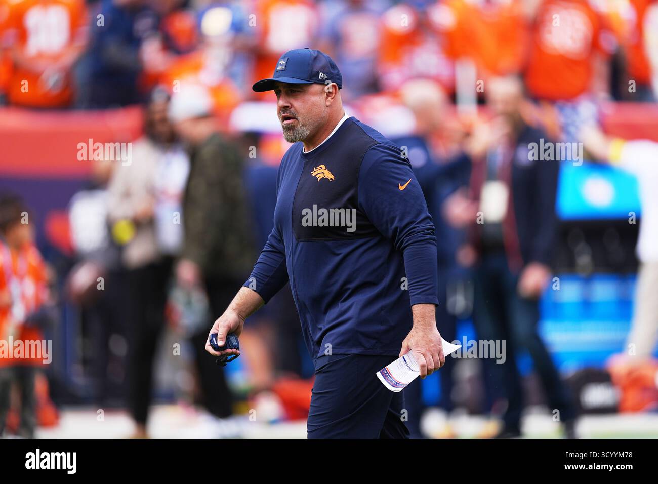 Denver Broncos special teams coordinator Darren Rizzi looks on as ...