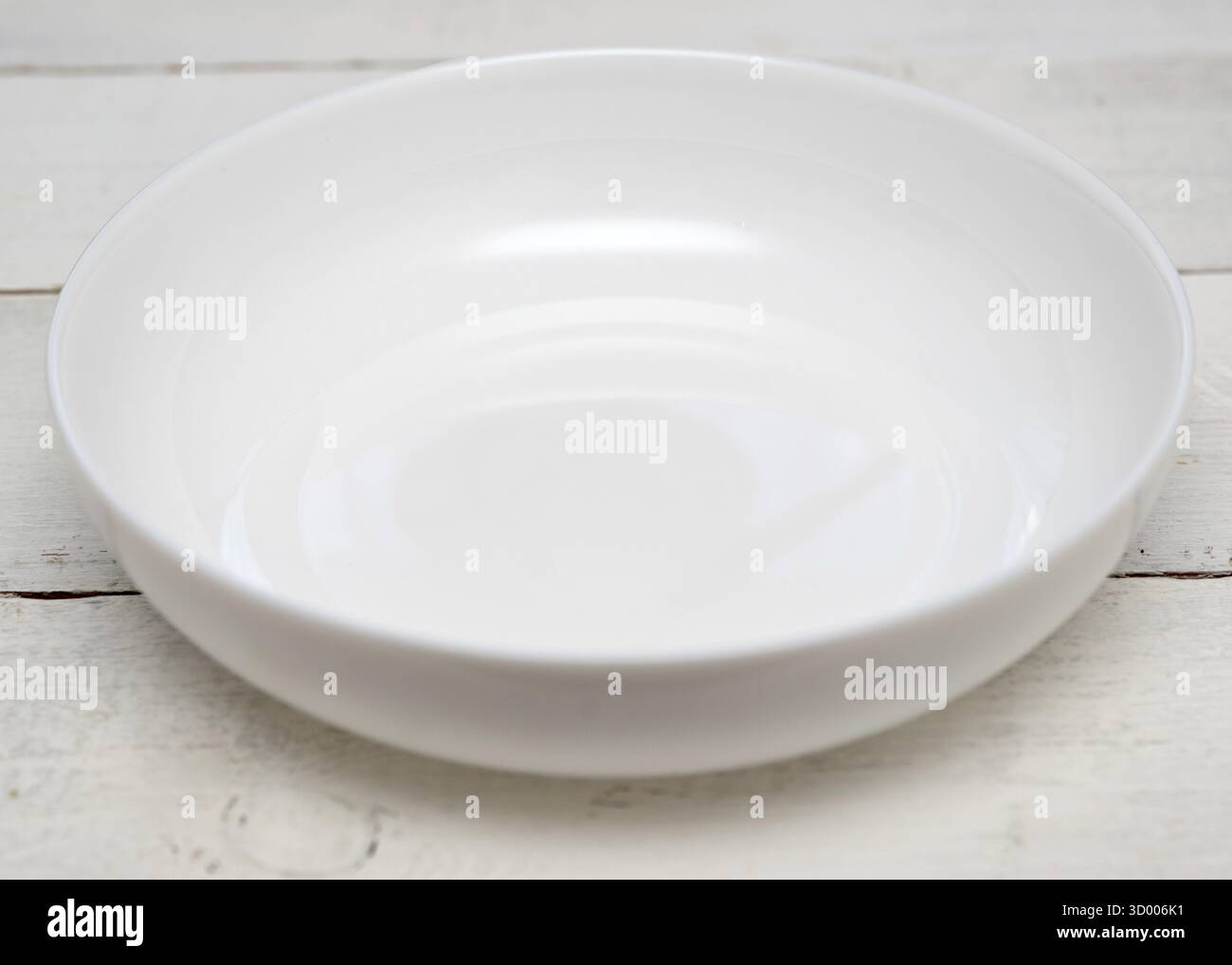 White empty plate on a wooden table Stock Photo