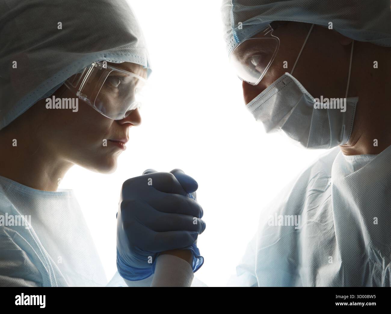 Doctors in gloves make handshake on white background Stock Photo