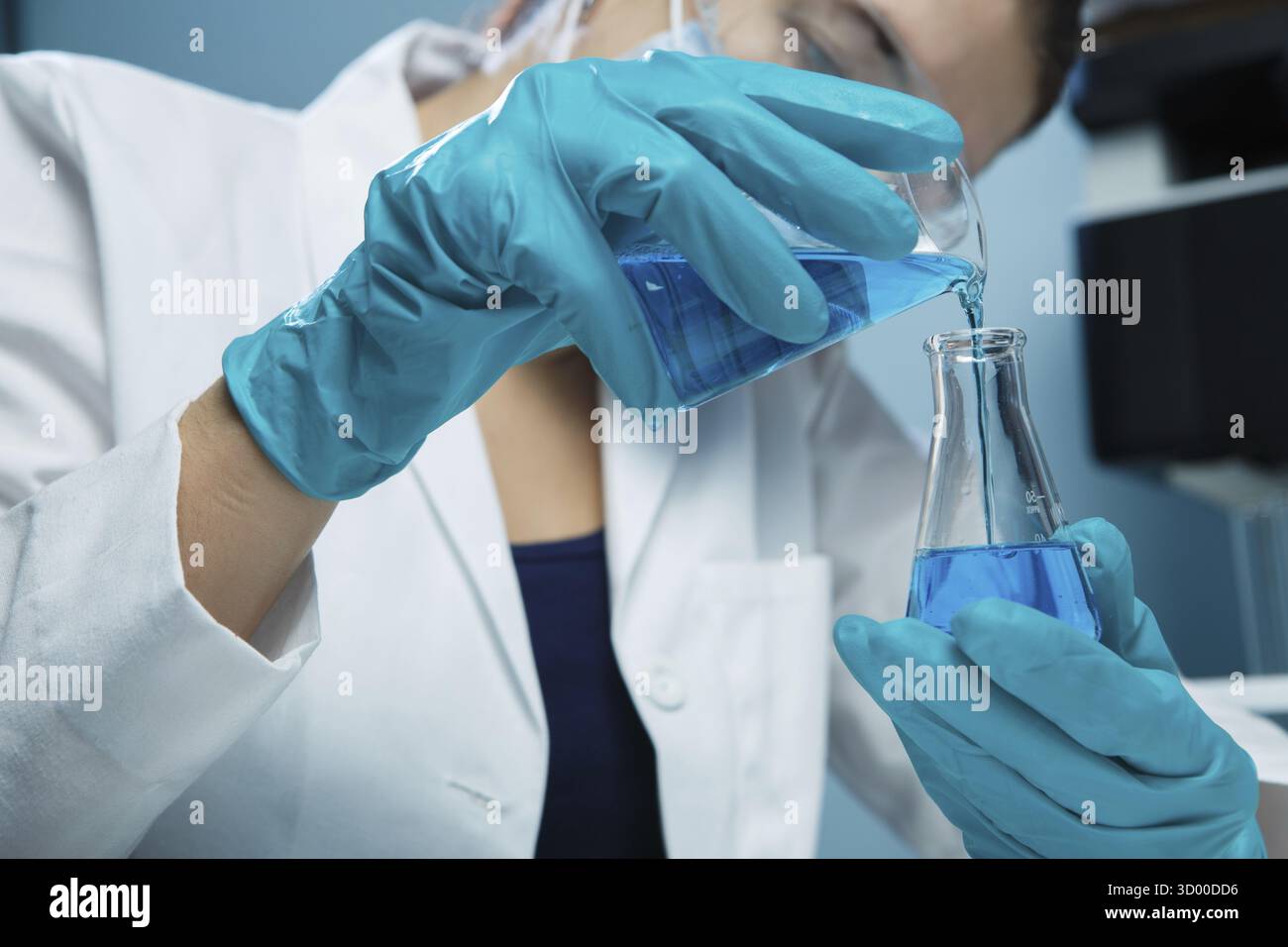 Laboratorian conducted experiments with flask in chemistry lab Stock ...