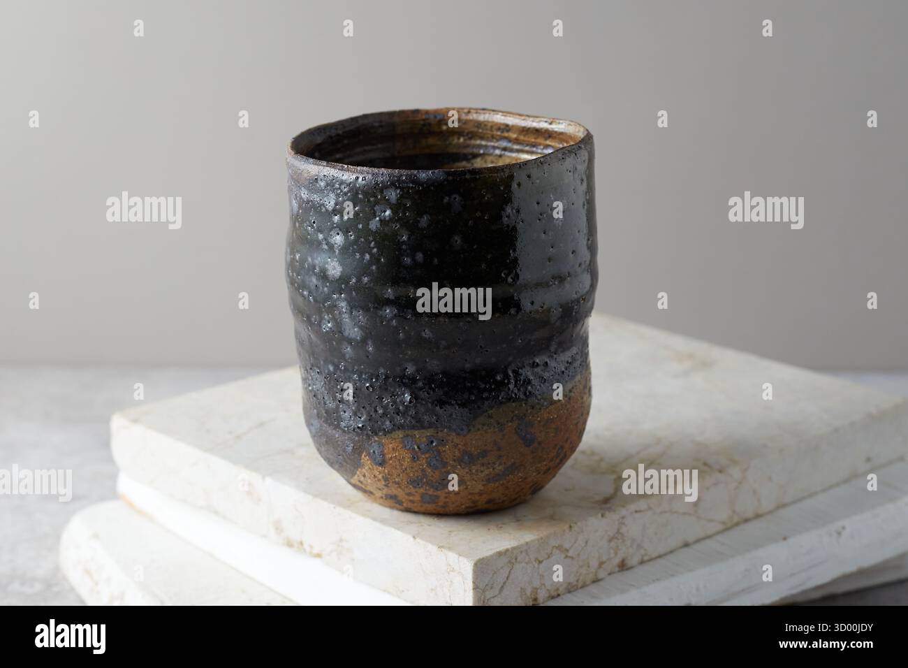 Close up ceramic cup on gray background, studio light Stock Photo