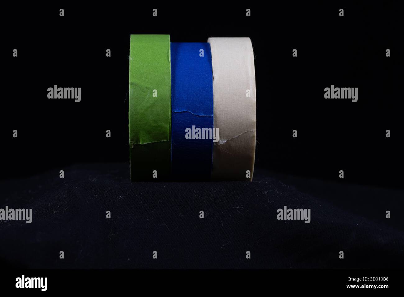 three multicoloured rolls of decorators masking tape isolated on Stock Photo
