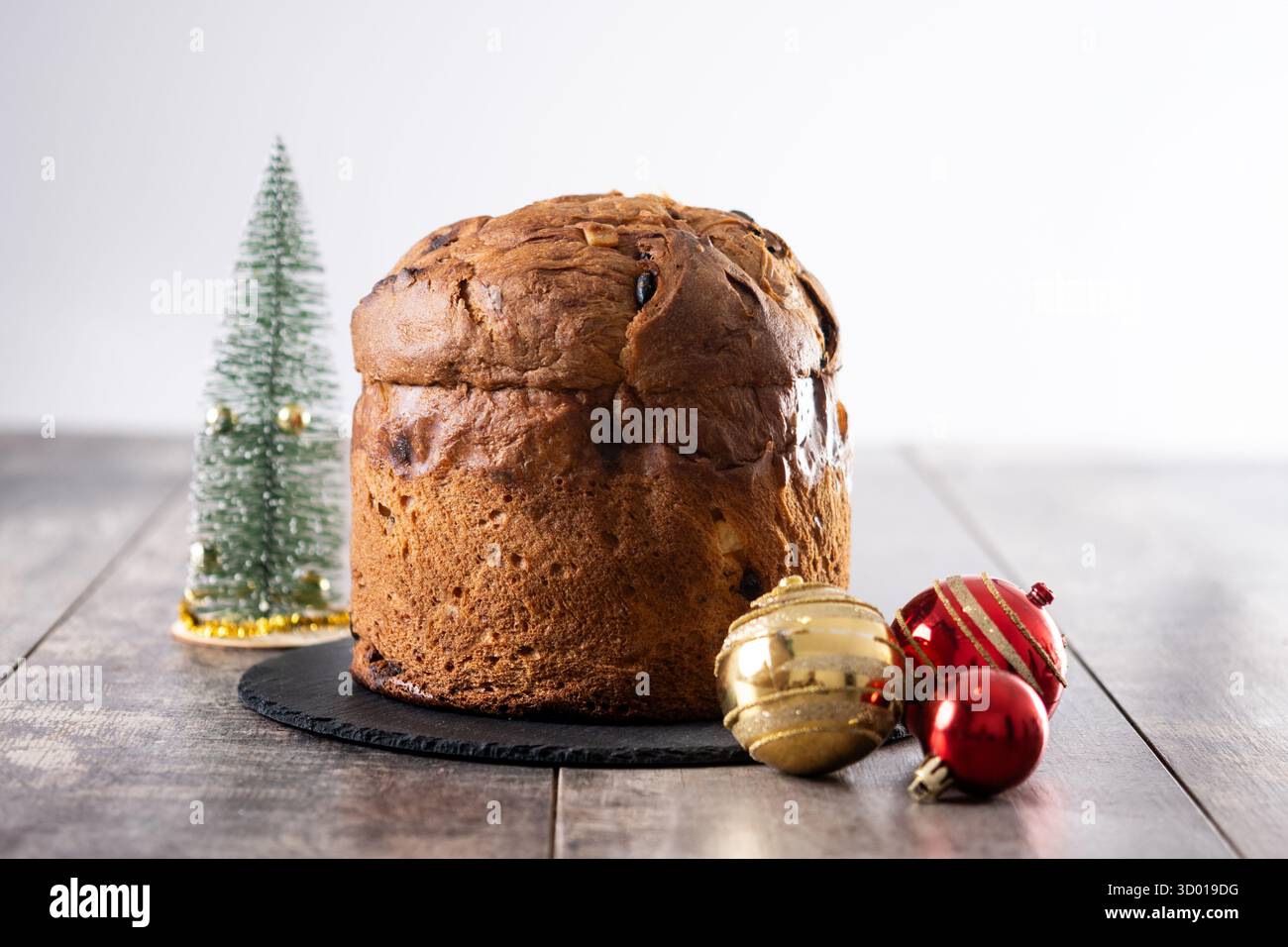 Traditional Italian Panettone on wooden table Stock Photo