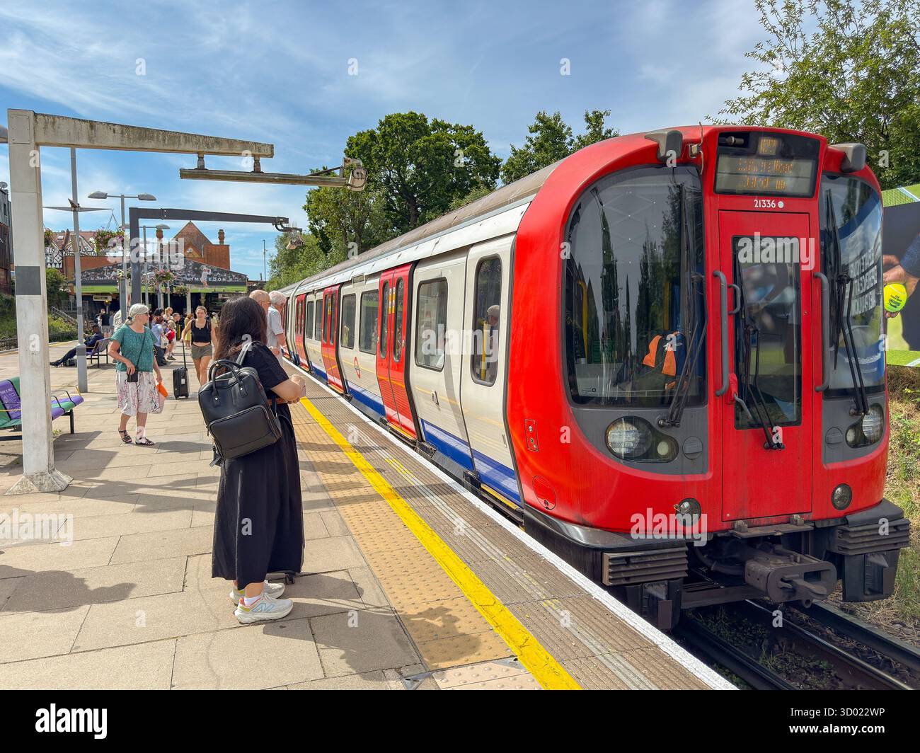 London, England, UK - 4 July 2024: People catching a London Underground train at Southfields station on the District Line. - Smartphone Captured Stock Image