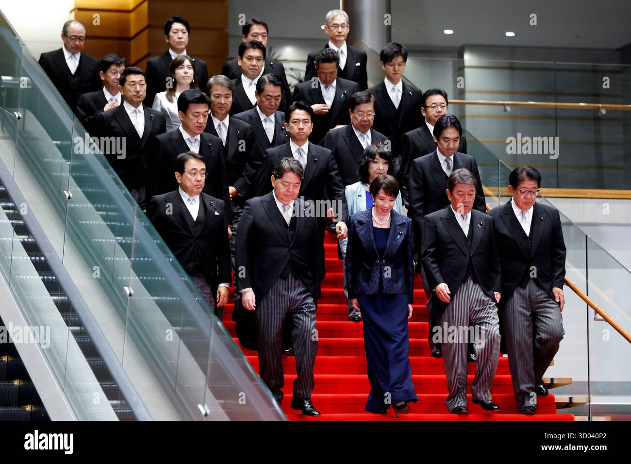 Japan's Prime Minister Sanae Takaichi, front row center, poses with her ...