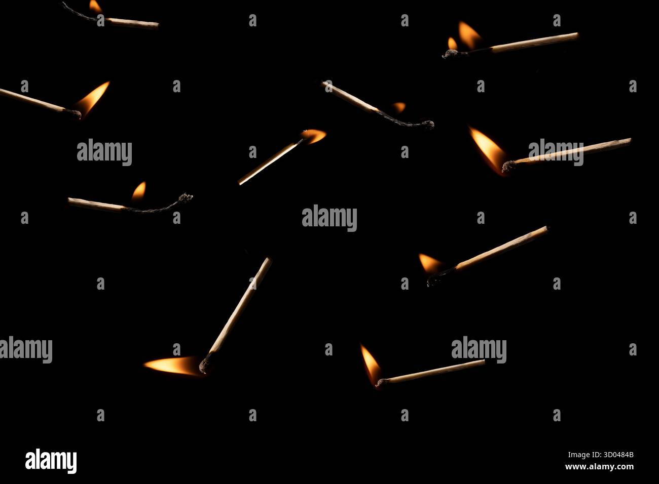 Lit and falling match on a black background. Stock Photo