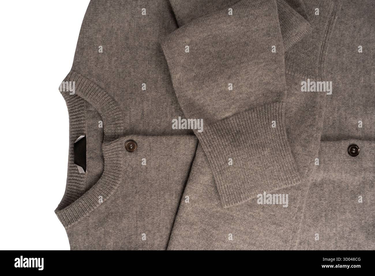 Grey cardigan texture as a background. Knitted pattern. Top view. Stock Photo