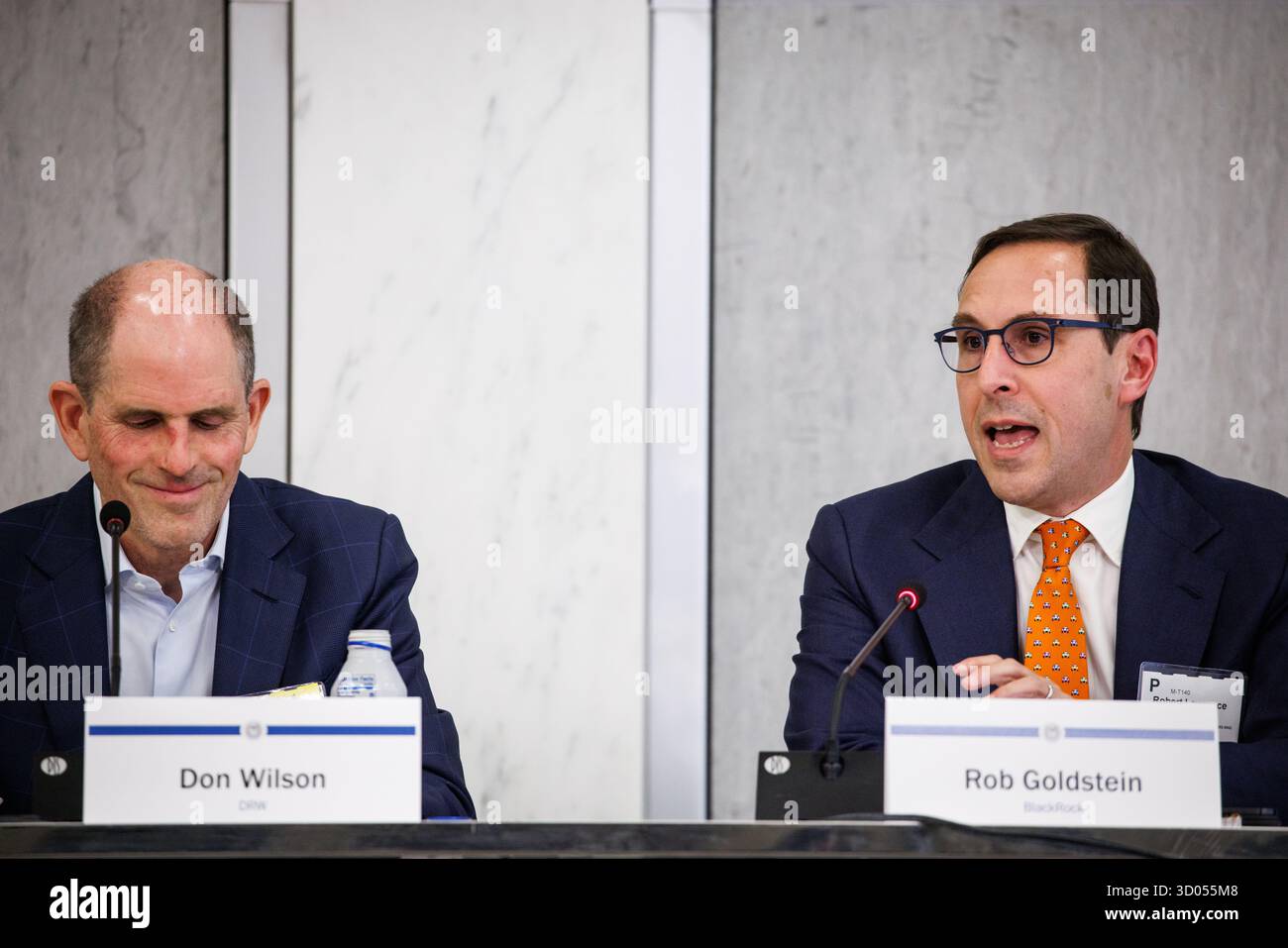 Washington, United States. 21st Oct, 2025. Don Wilson (left), Founder and  CEO at DRW, and Rob Goldstein (right), COO at BlackRock, during the  Payments Innovation Conference at the Federal Reserve on October