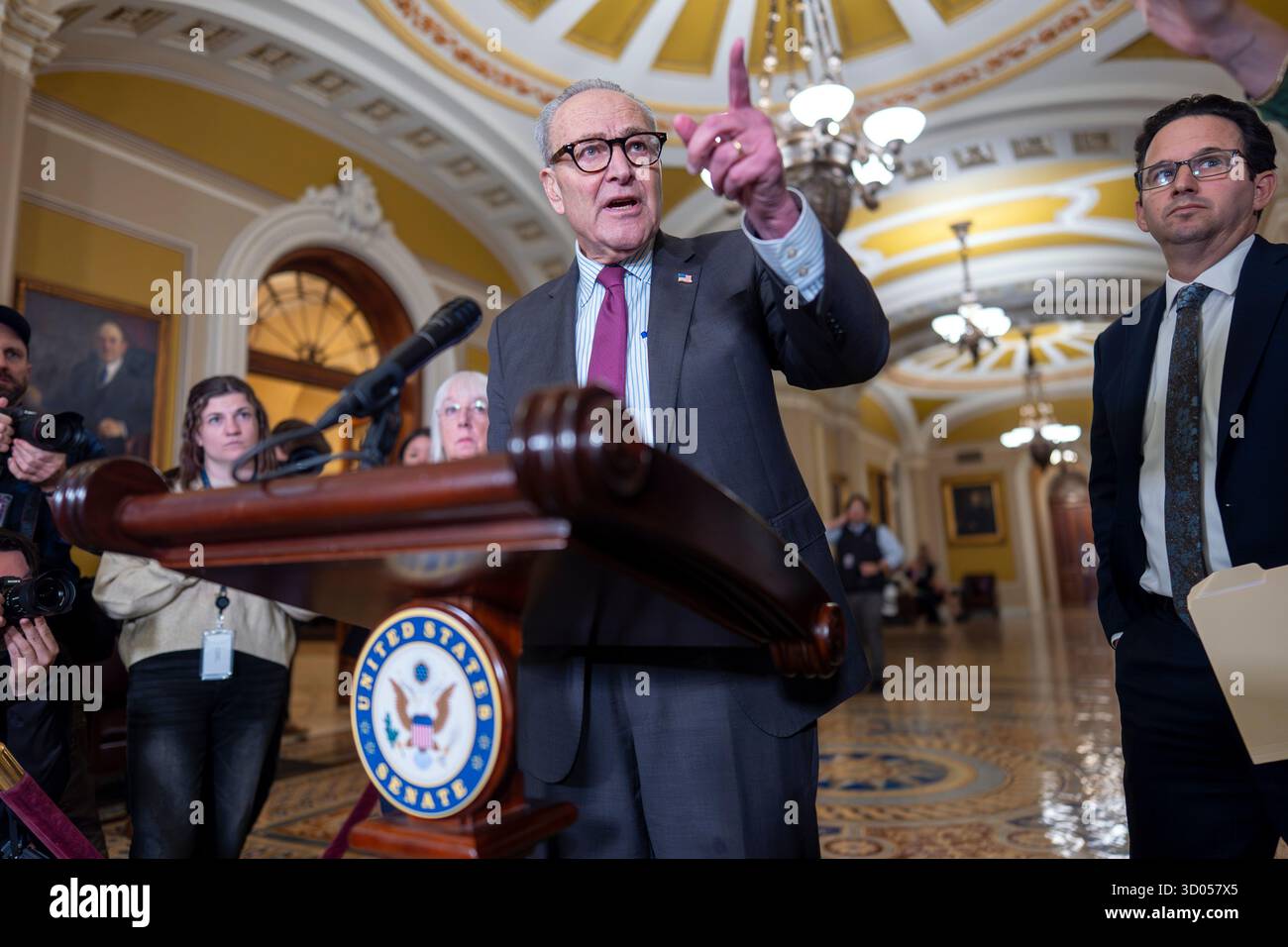 Senate Minority Leader Chuck Schumer, D-N.Y., joined at right by Sen ...