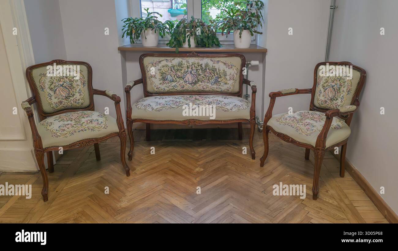 Patterned armchairs and sofas arranged in a cozy and stylish Bohemian interior. Design setting ethnic embroidery and vintage inspired textiles - Smartphone Captured Stock Image