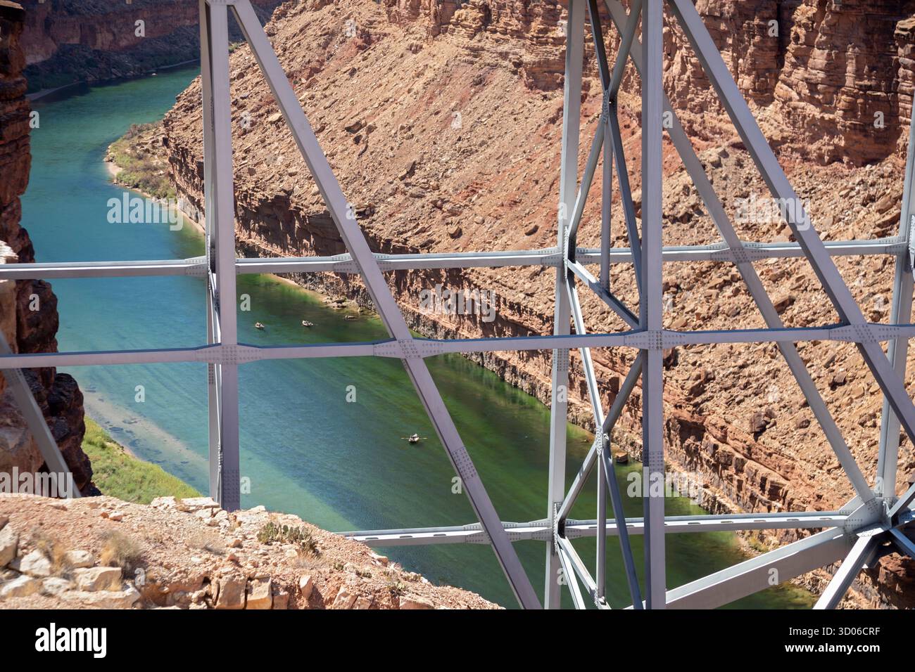 Marble Canyon, Arizona - Dories float under the Navajo Bridge which spans the Colorado River in Marble Canyon, headed towards the Grand Canyon. Stock Photo