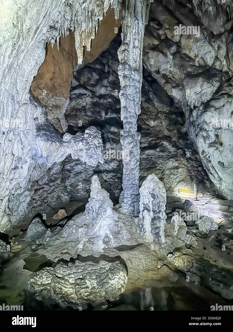 Stunning stalactites and stalagmites inside the Ice Cave (Ledena Pećina) in Uvac Canyon, Serbia, showcasing beautiful natural limestone formations. - Smartphone Captured Stock Image